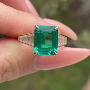 Timeless Elegance: Emerald on Moissanite Diamond Graduated Baguette Band
